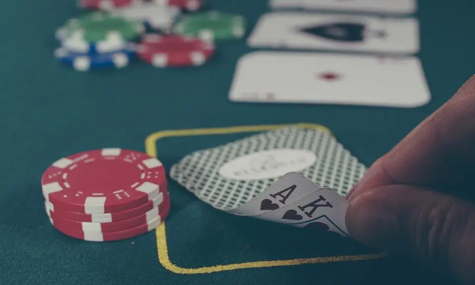 Blackjack cards and chips on a casino table